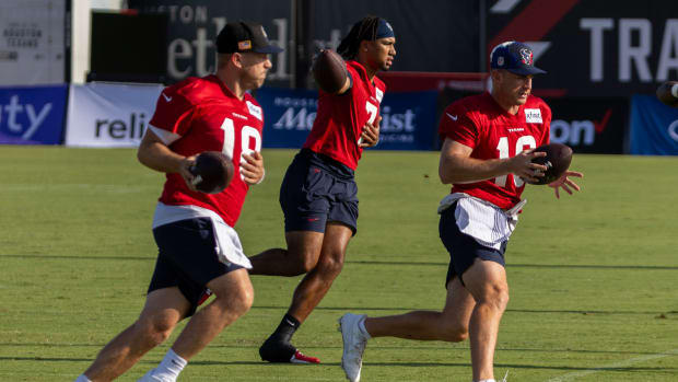 Texans quarterback Case Keenum and quarterback C.J. Stroud and quarterback Davis Mills (10) practice handoffs during training camp at the Houston Methodist Training Center.